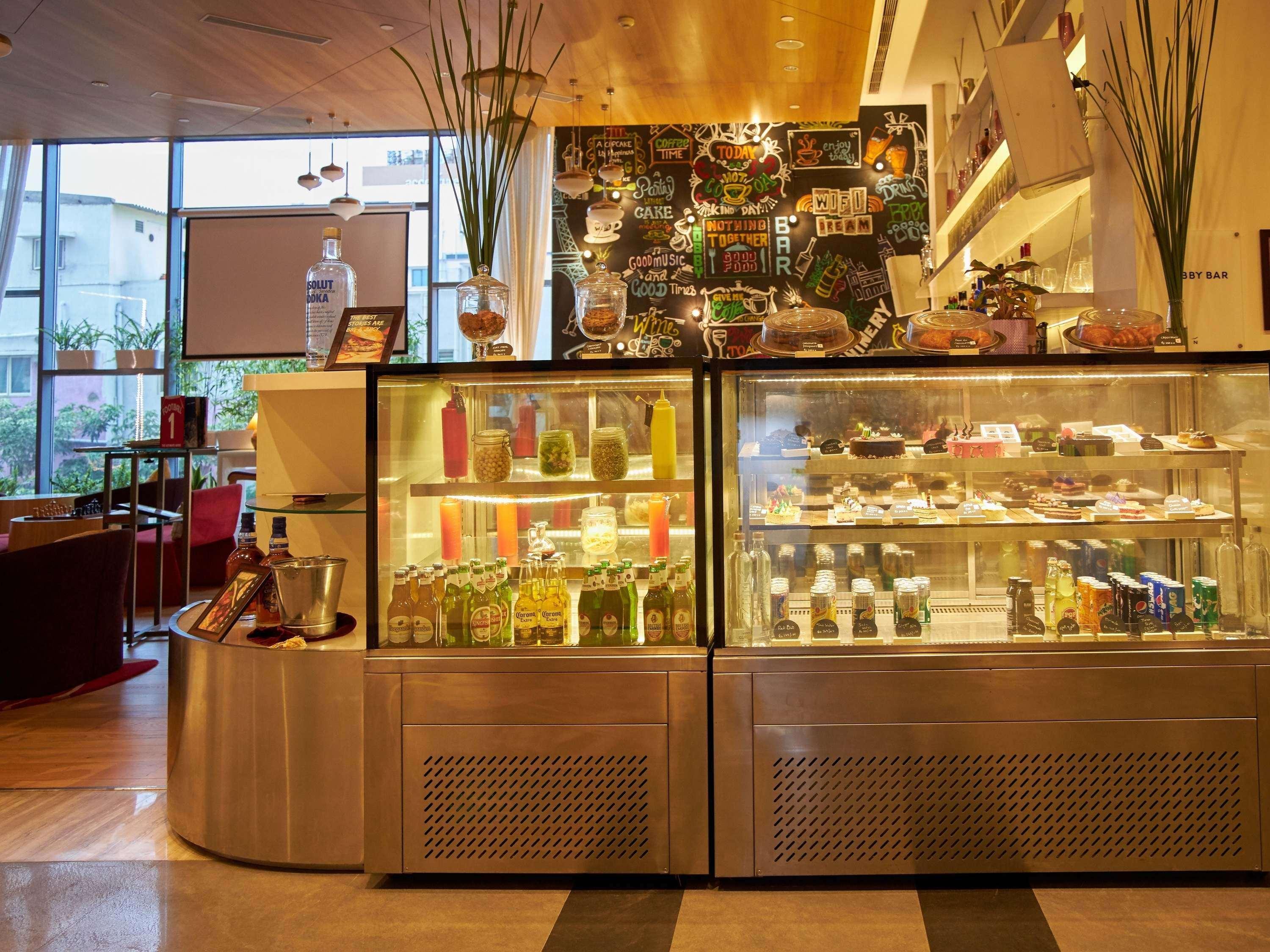 Novotel Chennai Sipcot Exterior photo The pastry counter at the lobby