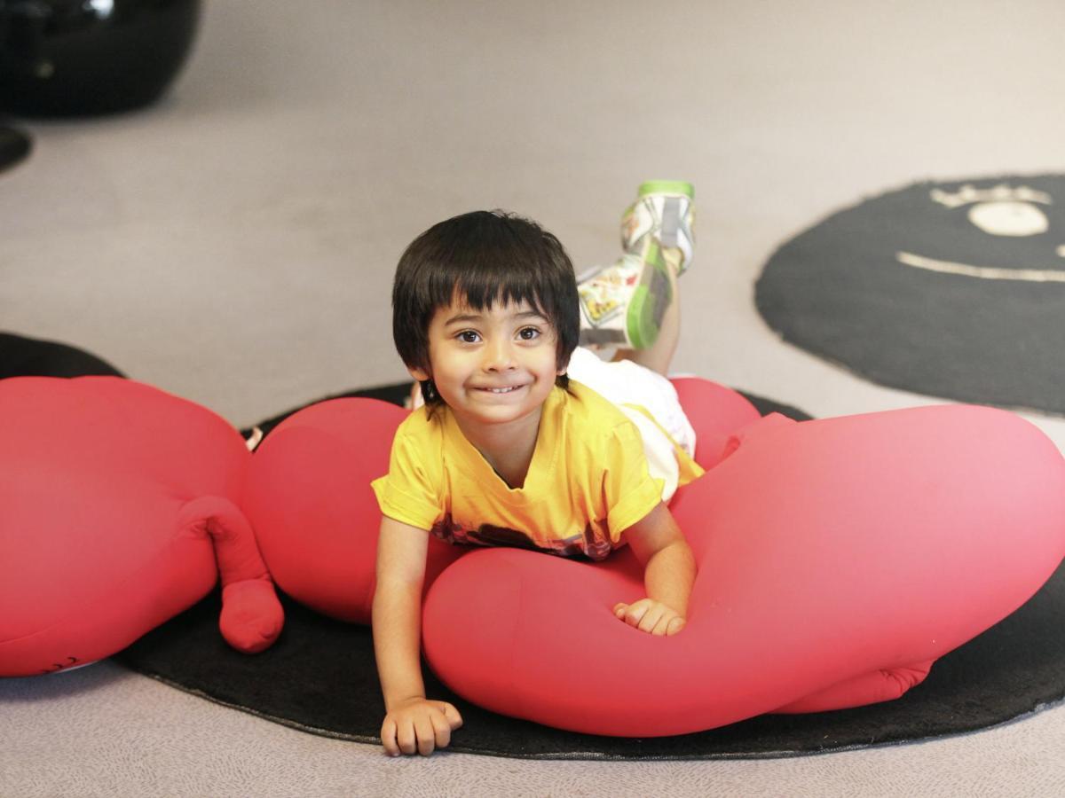 Novotel Chennai Sipcot Exterior photo A child playing with a bean bag